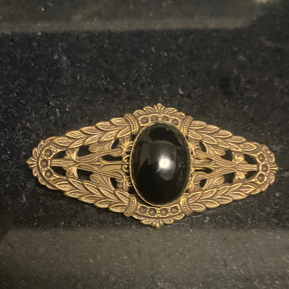 Elegant Black and Gold Brooch